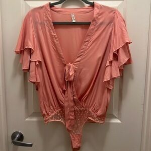 Free People Intimates. Call Me Later Bodysuit. Peach. Size Small. NWOT